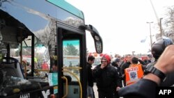 Paramedics and emergency services rush to the scene of a massive explosion outside Jerusalem's central bus station.