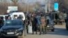 Kazakhstan Violence - Kazakhstan's riot police attend a blocked road after the conflict in Masanchi, near the border with Kazakhstan, Saturday, Feb. 8, 2020, a large population of Dungan, who are Muslims of Chinese ancestry. Kazakhstan's interior minister
