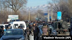 Kazakh riot police close to the village of Masanchi, where many of the clashes occurred. 