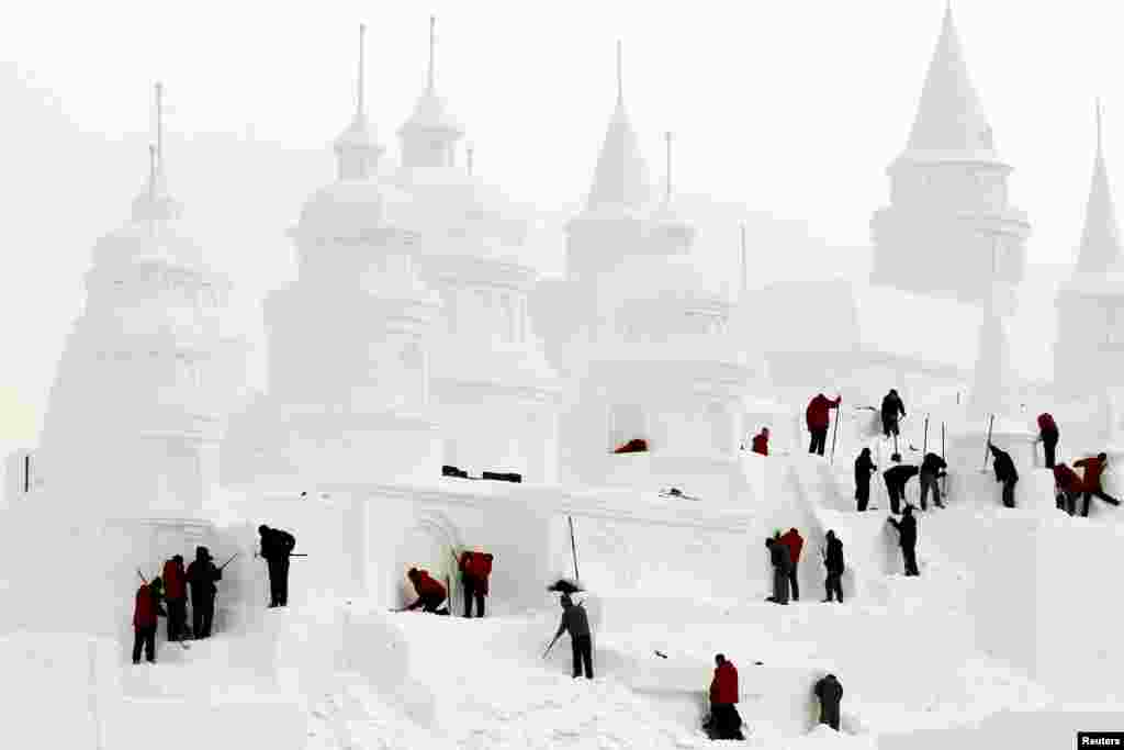 Chinese craftsmen make a snow castle at a park in Changchun, Jilin Province. (Reuters/China Daily)