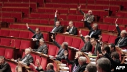 France -- Members of the French National Assembly vote an amendment at the French National Assembly in Paris, 22Dec2011