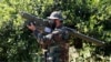 A Hizballah fighter holding an Iranian-made anti-aircraft missile.