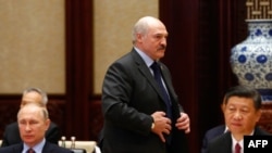 Russian President Vladimir Putin (left), Chinese President Xi Jinping (right), and Belarusian President Alyaksandr Lukashenka (center) attend the One Belt, One Road summit in Beijing on May 15.