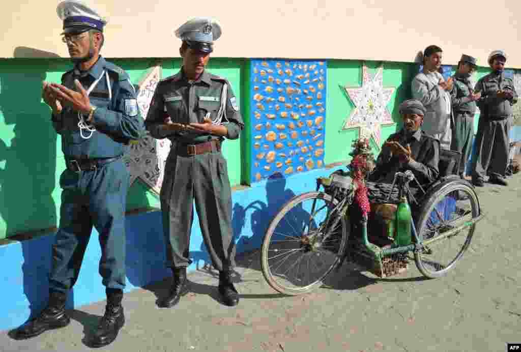 Afghan traffic police pray to celebrate Eid al-Adha at the Shah-e Do Shamshira mosque in Kabul. (AFP/Noorullah Shirzada)