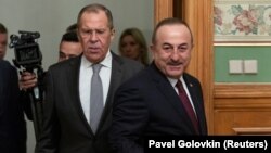 RUSSIA -- Turkish Foreign Minister Mevlut Cavusoglu and Russian Foreign Minister Sergei Lavrov arrive for a meeting in Moscow, January 13, 2020