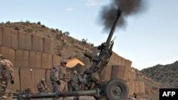 Troops fire an artillery field gun in Paktia Province, where heavy fighting has been reported in recent days.