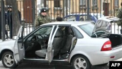 Police examine the site of a blast in St. Petersburg.