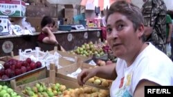 Armenia -- A trader at an agricultural market in Yerevan, 7July 2010.