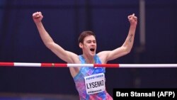 Danil Lysenko from Russia celebrates after the winning clearance in the men's high jump final at the 2018 IAAF World Indoor Athletics Championships in Birmingham, England, on March 1, 2018.