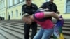 A gay activist is detained by police during a gay-pride parade in St. Petersburg in June 2011.