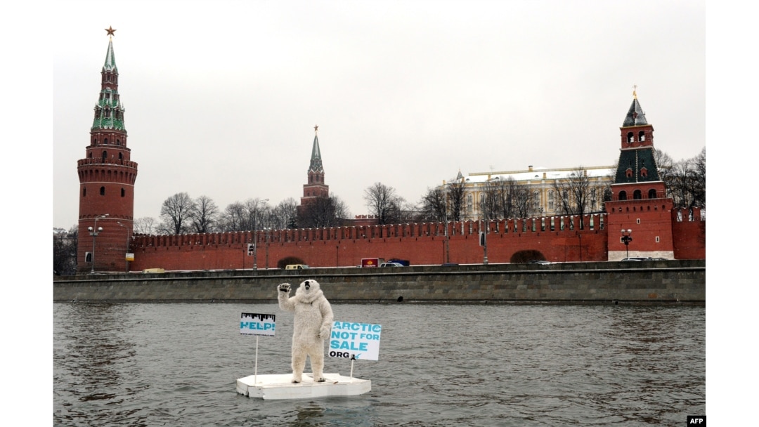 Wearing a polar bear costume, a Greenpeace activist takes part in a protest on the Moskva River in front of the Kremlin in Moscow on April 1 to draw attention to the consequences of Arctic oil drilling..