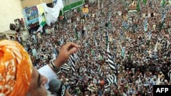 Maulana Fazalur Rehman (left), chief of the Pakistani religious party Jamiat Ulema Islam (JUI), addresses the crowd during a rally in Karachi on January 9.