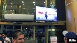 Anonymous hackers hacked the Mashad airport's screens for an hour on Thursday night May 24, 2018. The screen shows image of an anti-hijab protester.