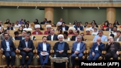 Iranian President Hassan Rohani (C) attends an event marking government achievements in rural areas, in the capital Tehran, August 26, 2019