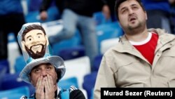 Argentina fans looking dejected after their loss to Croatia at the World Cup.