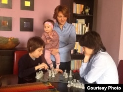 Marijana Kadic-Bojanic with her two sons, Niksa and David, and her 7-month daughter, Iskra.