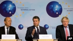 BELGIUM -- (L-R) French Foreign Affairs Minister Jean-Yves Le Drian, German Foreign Minister Sigmar Gabriel and British Foreign Secretary Boris Johnsonspeaks attend a media conference after a meeting of the EU3 and Iran at EEAS headquarters in Brussels, J