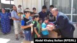 Christians flee the Iraqi town of Mosul earlier this month after threats from Islamic extremists.