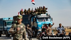شماری از نیروهای دولتی سوریه در حال ورود به شهر تل تمر در اکتبر ۲۰۱۹