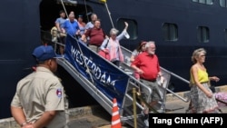 Passengers disembark from the Westerdam cruise ship in Sihanoukville on February 14. There were eight Russian passengers aboard.