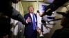 U.S. President Trump speaks to reporters aboard Air Force One on his way back to Washington