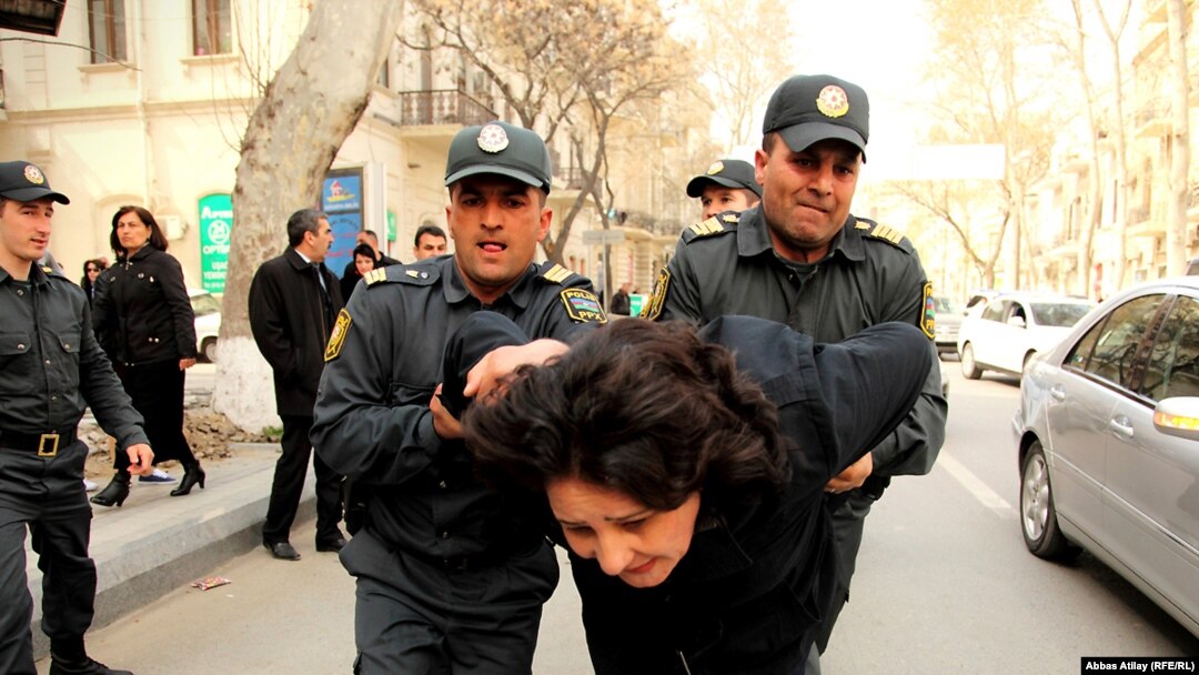 Azerbaijan -- police detain opposition activist Gozal Bayramli during a protest in downtown Baku, 17Apr2011