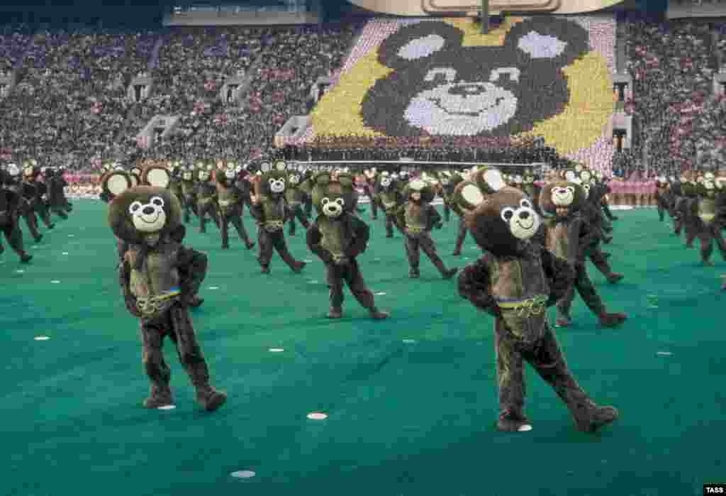 Dozens of performers are dressed as Misha, the Olympic mascot, at Luzhniki Stadium in Moscow during the opening ceremonies. 