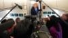 US President Donald Trump speaks to reporters aboard Air Force One on August 2.