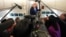 US President Donald Trump speaks to reporters aboard Air Force One on August 2.