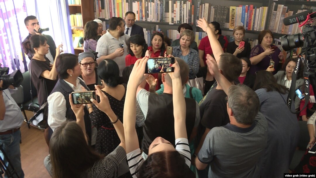 The press conference in Almaty on June 7 was halted when a group of around 20 women barged in and started shouting slogans.