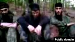 Chechen rebels like Doku Umarov (center in low-quality still from Internet video) have frequently used YouTube to spread their message beyond Russia's borders.