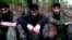 Chechen rebels like Doku Umarov (center in low-quality still from Internet video) have frequently used YouTube to spread their message beyond Russia's borders.