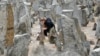 A young girl lights a candle in front of a monument at the Treblinka World War II-era Nazi death camp in Poland on October 2.