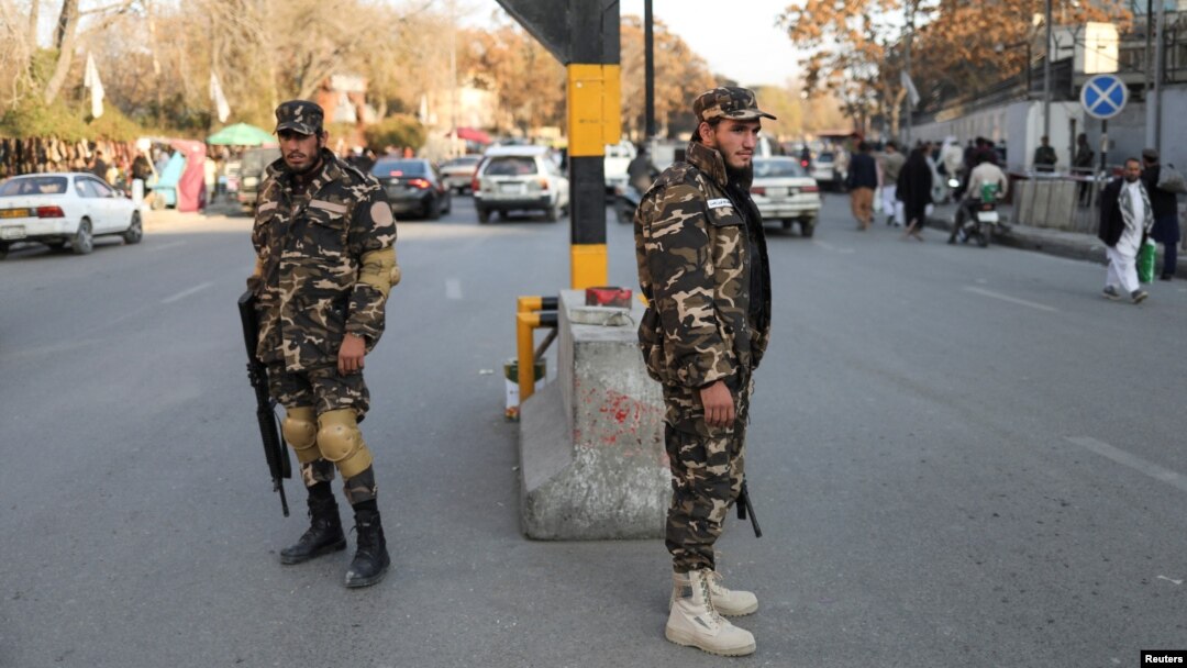 Taliban fighters watch a street in Kabul. (file photo)