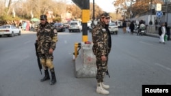 Taliban fighters watch a street in Kabul. (file photo)