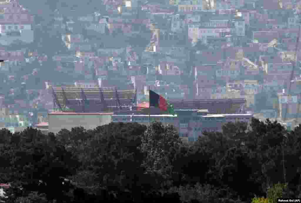 The Afghan flag still flew over the Presidential Palace in Kabul on August 17.