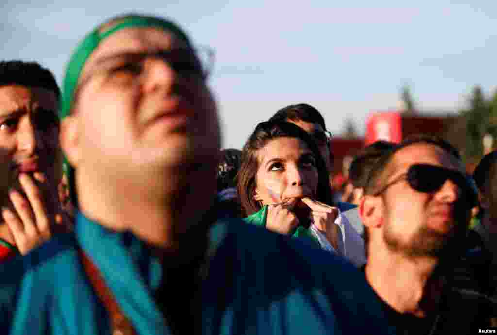 Soccer Football - World Cup - Group B - Morocco vs Iran - Moscow, Russia - June 15, 2018. Supporters watch the match in a fan zone. REUTERS/Gleb Garanich