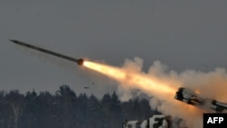 Belarus -- An army Smerch (Tornado), Soviet-made heavy multiple rocket launcher, fires during exercises in the Brest region, 25Jan2011