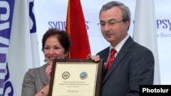 Armenia -- U.S. Ambassador Marie Yovanovitch gives an award to Hovik Musayelian, CEO of Synopsis-Armenia, 10Nov2010.