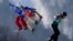 Athletes race in the final in the Snowboard Ladies' Cross at the Extreme Park course.