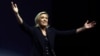 National Rally leader Marine Le Pen reacts on stage in Henin-Beaumont, France, after hearing partial results in the first round of the French parliamentary elections.