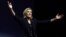 National Rally leader Marine Le Pen reacts on stage in Henin-Beaumont, France, after hearing partial results in the first round of the French parliamentary elections.