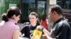 Armenia - An anti-smoking campaigner talks to passersby in Yerevan, 31May2011.