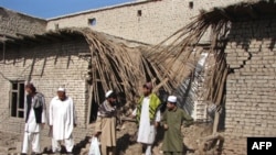 Tribesmen gather at the site of an earlier missile attack in North Waziristan in October