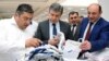 Armenia - Prime Minister Karen Karapetian (C) and Economic Development Minister Suren Karayan (R) visit a textile factory in Yerevan, 19 June, 2017.