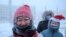 Russia -- Participants of the New Year's Eve race run gather near a Christmas tree, after the temperature went below minus 47 degrees Celsius