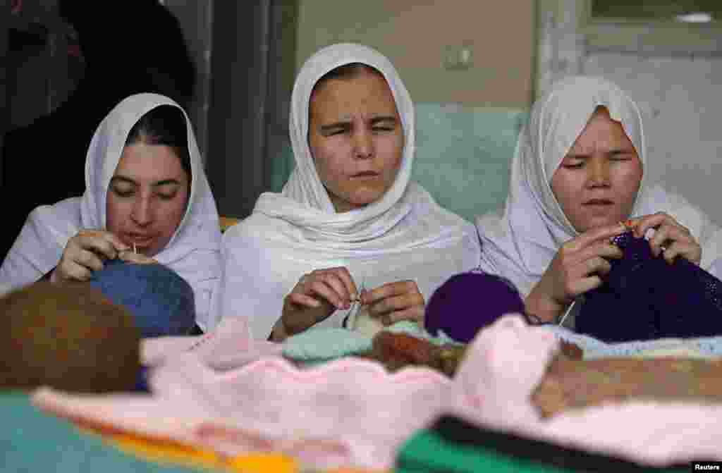 Students weave jackets at the Kabul Blind School.