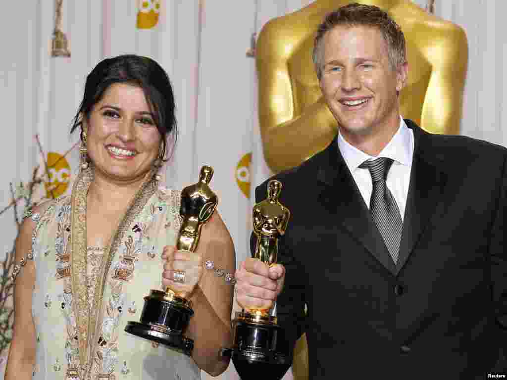 Redatelji Sharmeen Obaid-Chinoy i Daniel Junge, nagrađeni za najbolji dokumentarni kratki film "Saving Face", 26.02.2012. Foto: Reuters / Mike Blake