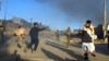 Afghan security officials shift injured victims from the scene of a suicide bomb attack that targeted a conoy of foreign forces in Lashkar Gah, Helmand in November.