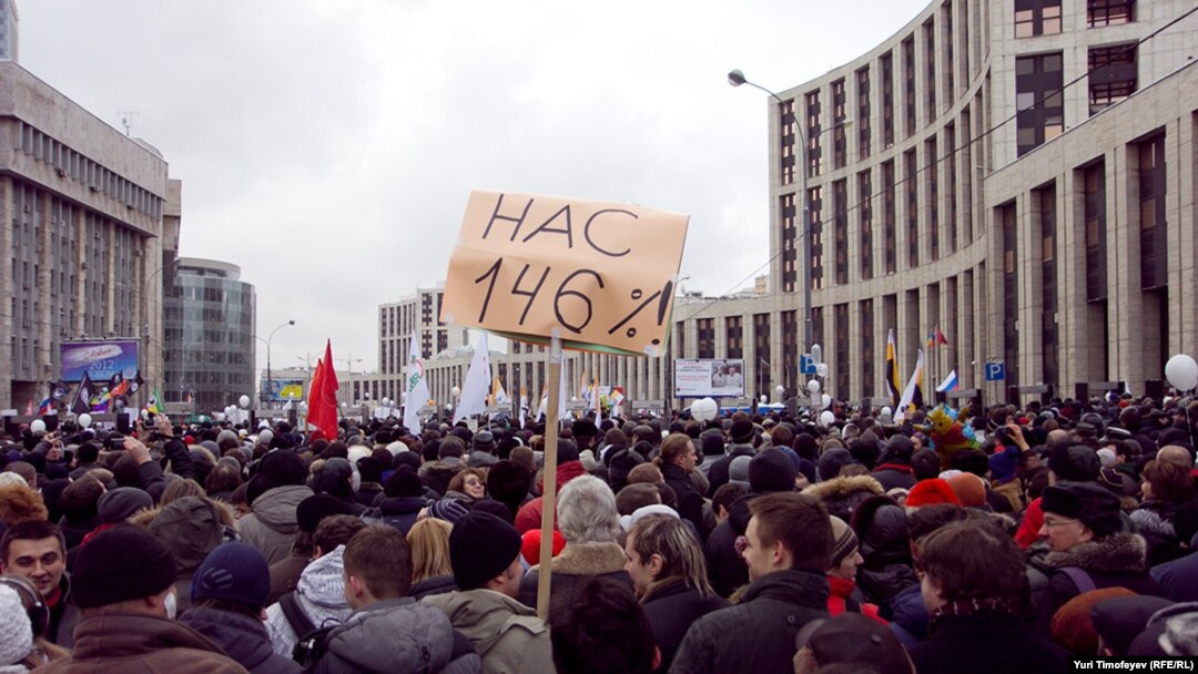 People attend For Fair Elections rally in Moscow December 24, 2011